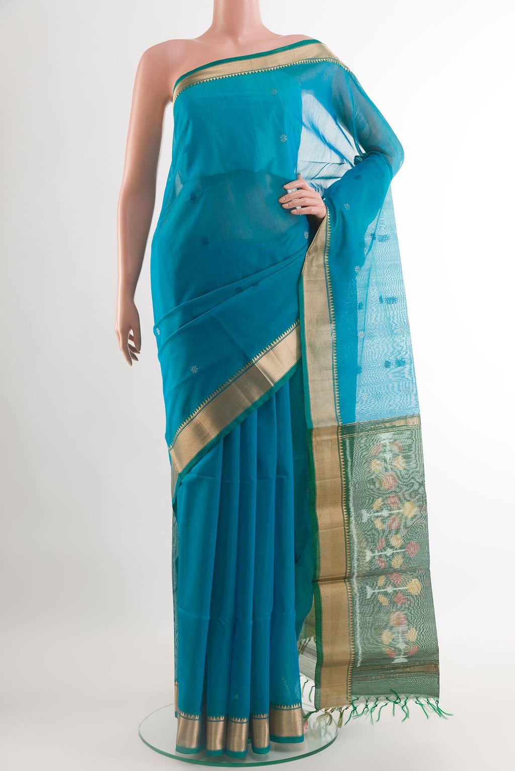 Blue Blended Kora Silk Saree with Zari Butta on the body and Zari Border.  displayed on a mannequin