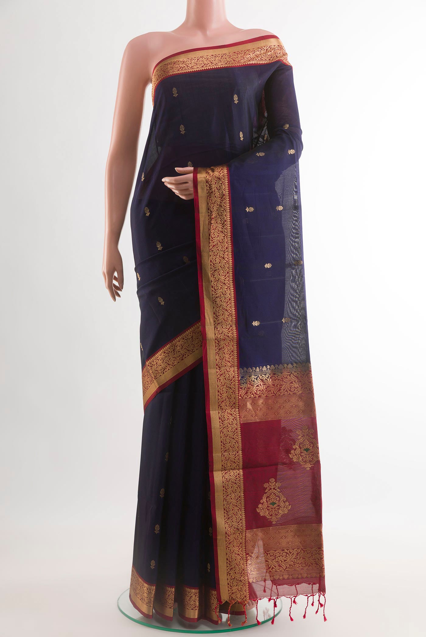 Blue Soft Silk Saree with Zari Butta on the body and Zari Border.  displayed on a mannequin