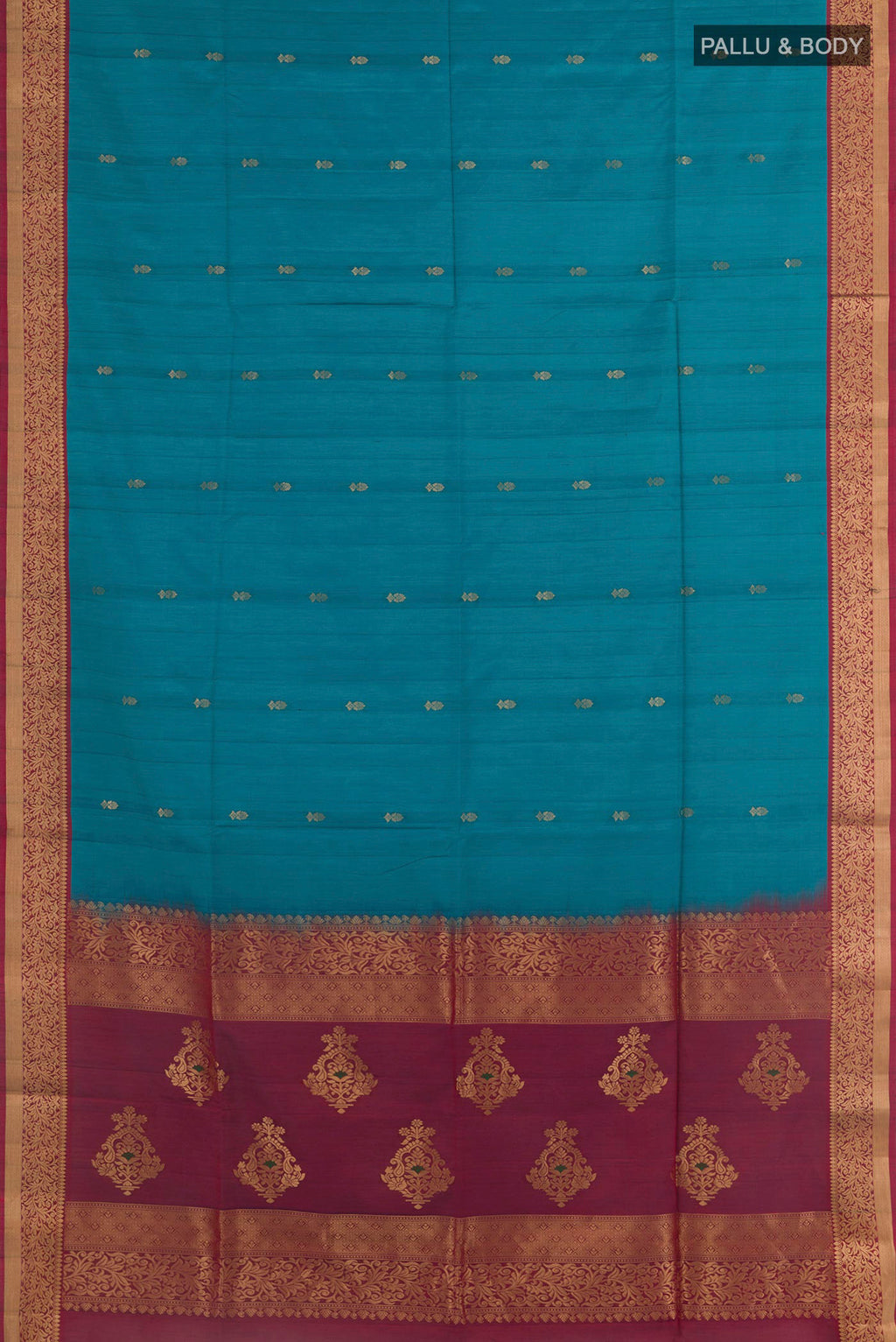 Flat view of Blue Soft Silk Saree with Zari Butta on the body and Zari Border. 