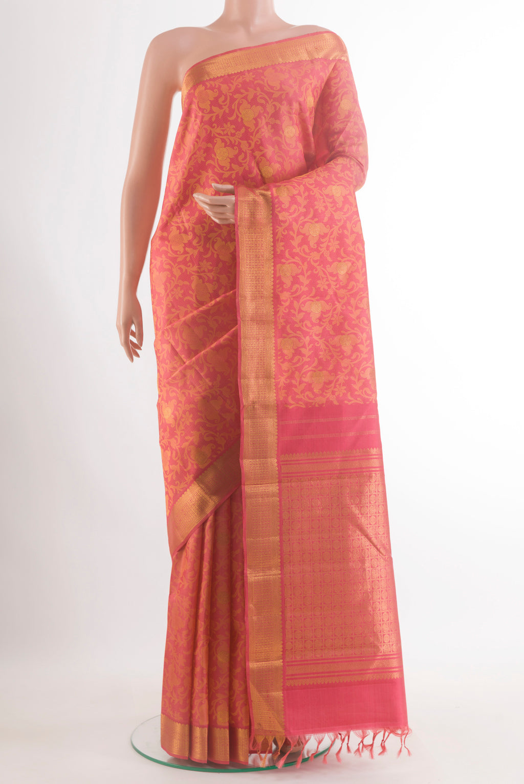 Pure Silk Brick Orange Kanjivaram Saree with Jacquard With Zari Butta on the body and Zari Border.  displayed on a mannequin