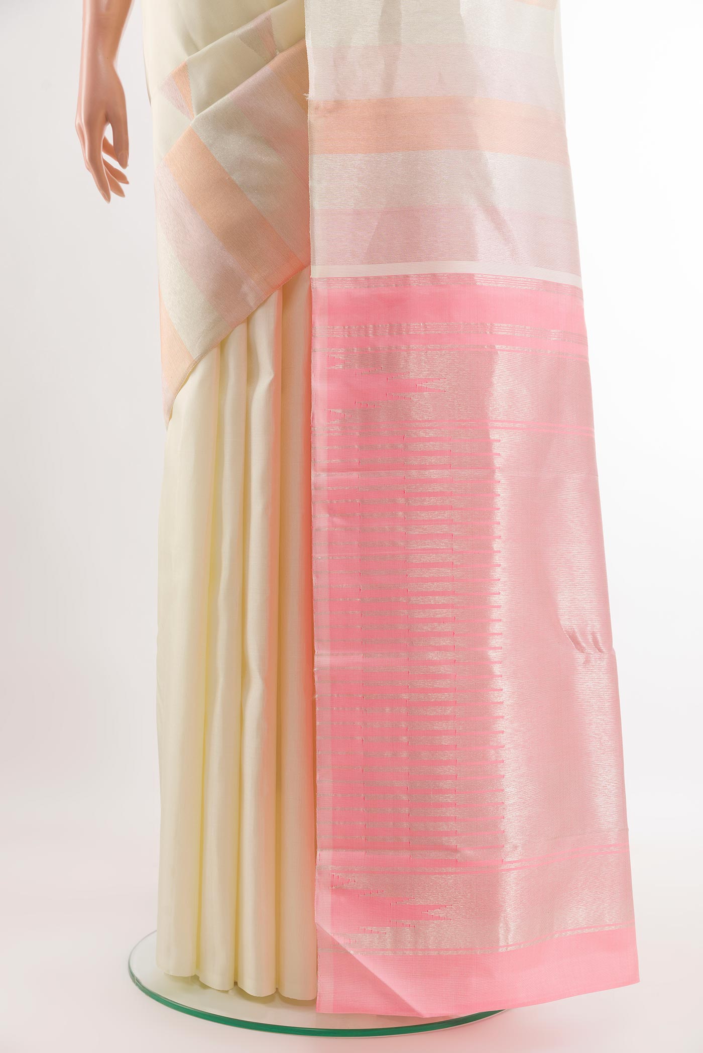Pleats and pallu of Off White Kanchipuram Silk Saree with Zari Brocade on the body and Zari Border. 