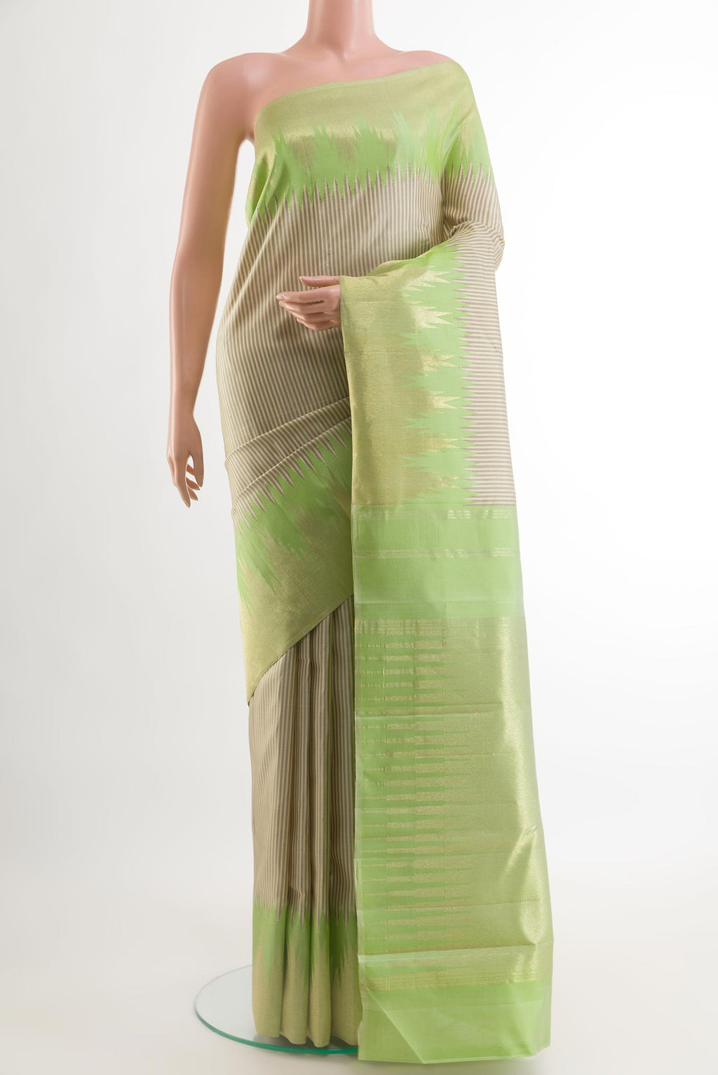 Off White Kanchipuram Silk Saree with Stripes on the body and Zari Border.  displayed on a mannequin