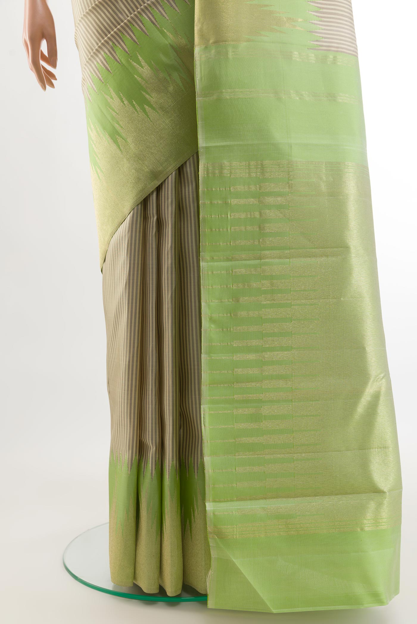Pleats and pallu of Off White Kanchipuram Silk Saree with Stripes on the body and Zari Border. 