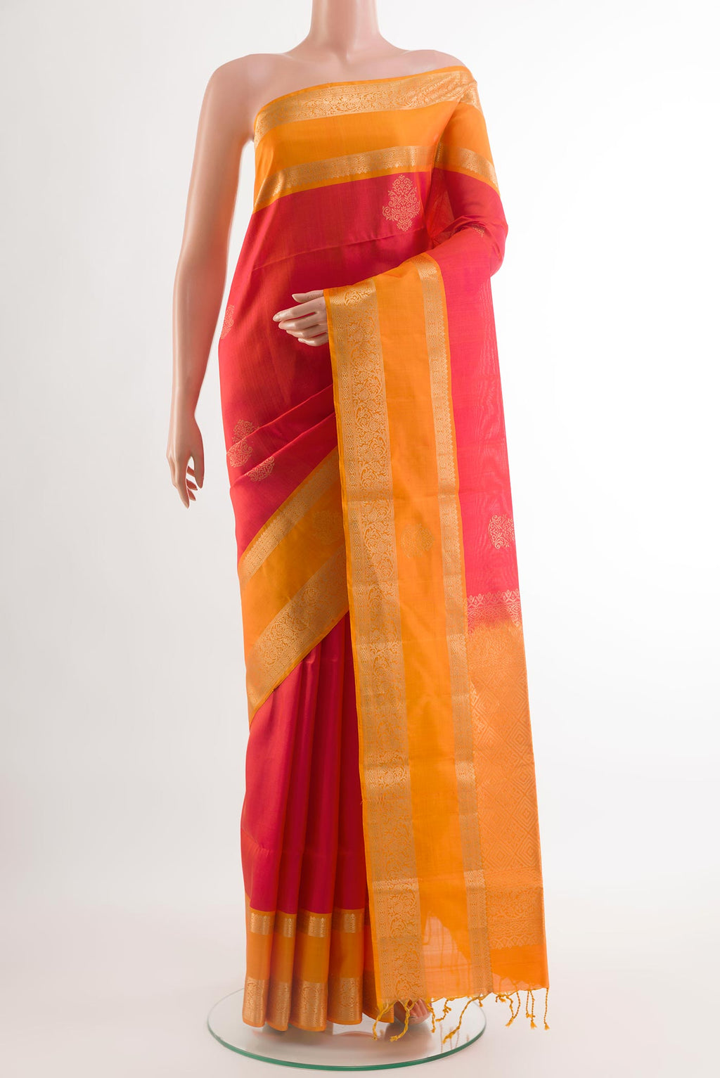 Pink Soft Silk Saree with Zari Butta on the body and Zari Border.  displayed on a mannequin
