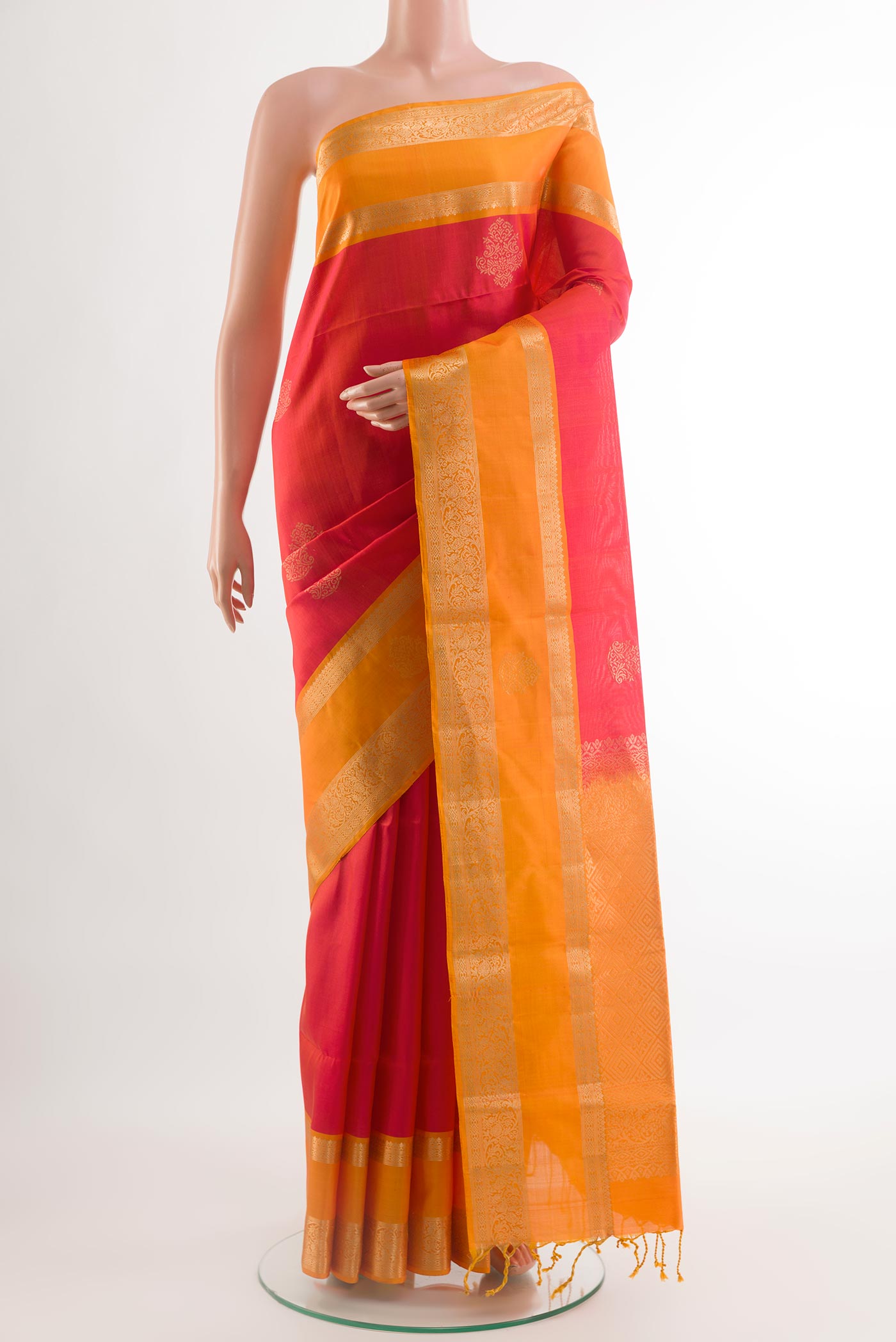 Pink Soft Silk Saree with Zari Butta on the body and Zari Border.  displayed on a mannequin