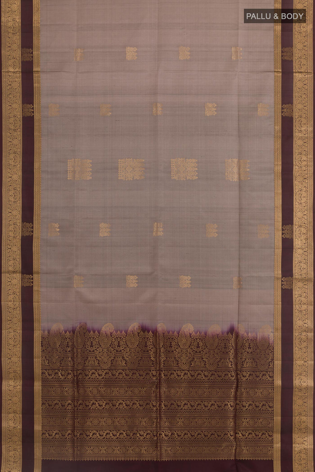 Flat view of Grey Soft Silk Saree with Zari Butta on the body and Zari Border. 