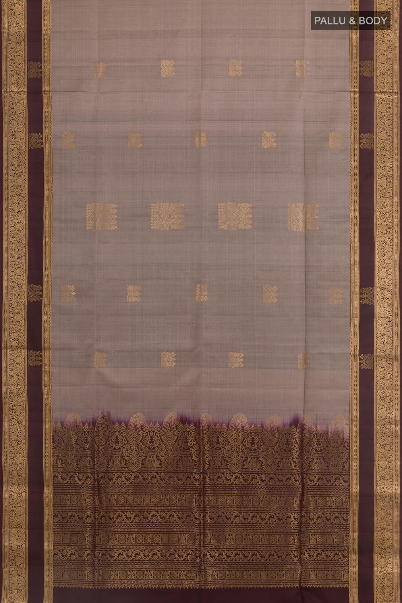 Flat view of Grey Soft Silk Saree with Zari Butta on the body and Zari Border. 