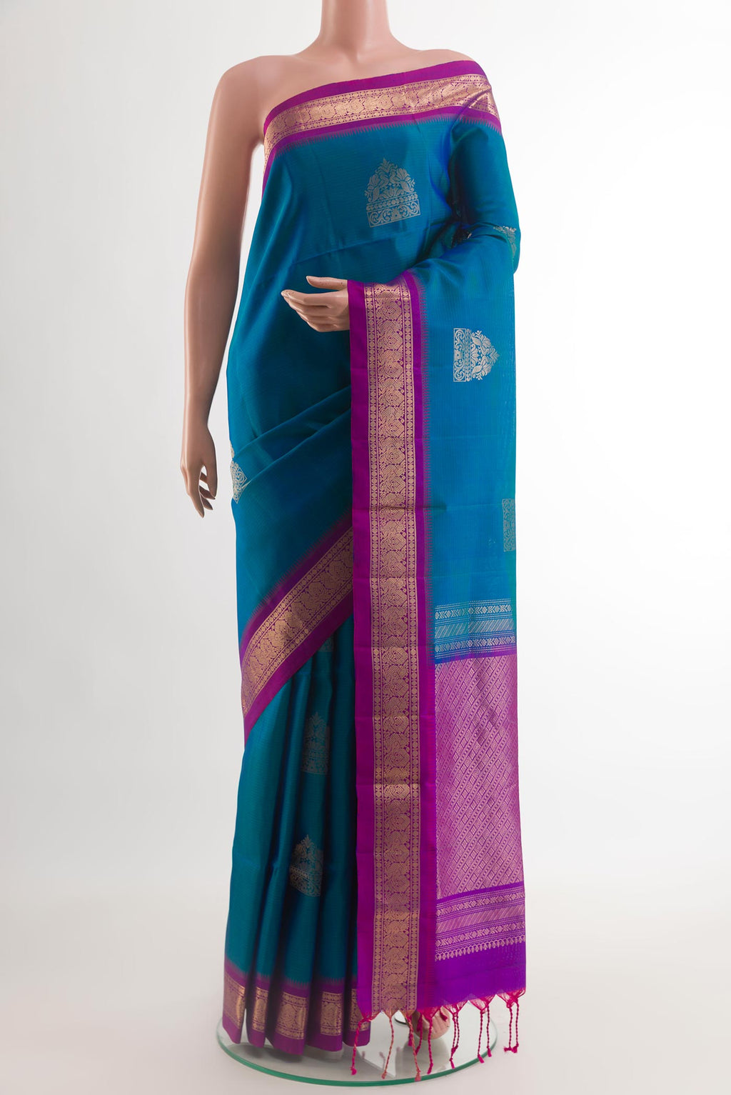 Blue Soft Silk Saree with Zari Butta on the body and Zari Border.  displayed on a mannequin