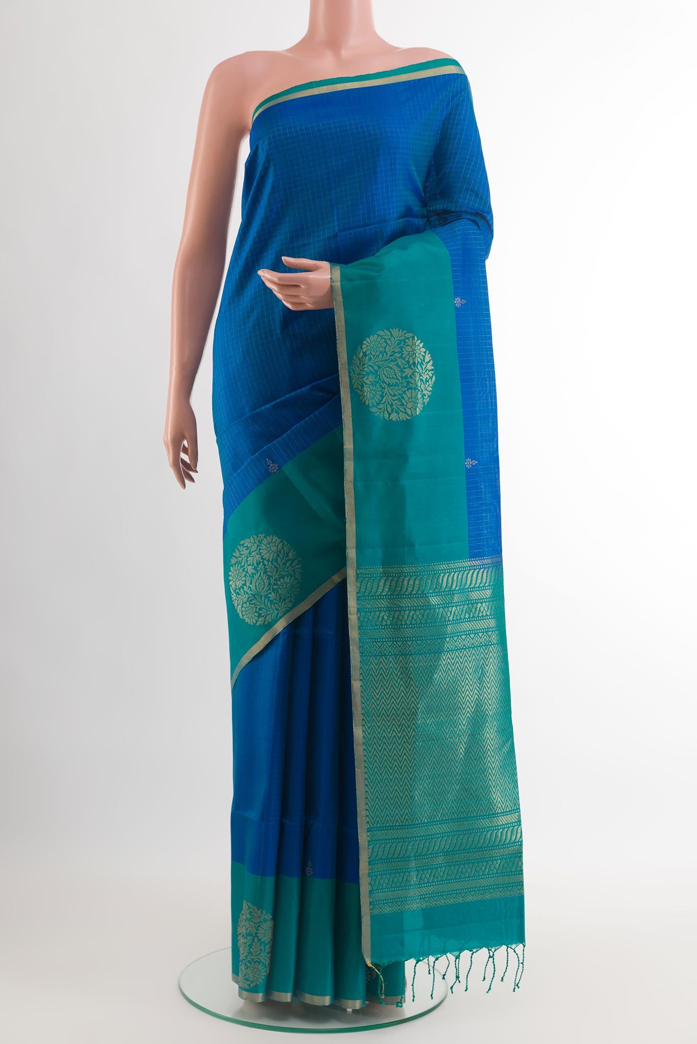 Blue Soft Silk Saree with Zari Butta on the body and Zari Border.  displayed on a mannequin