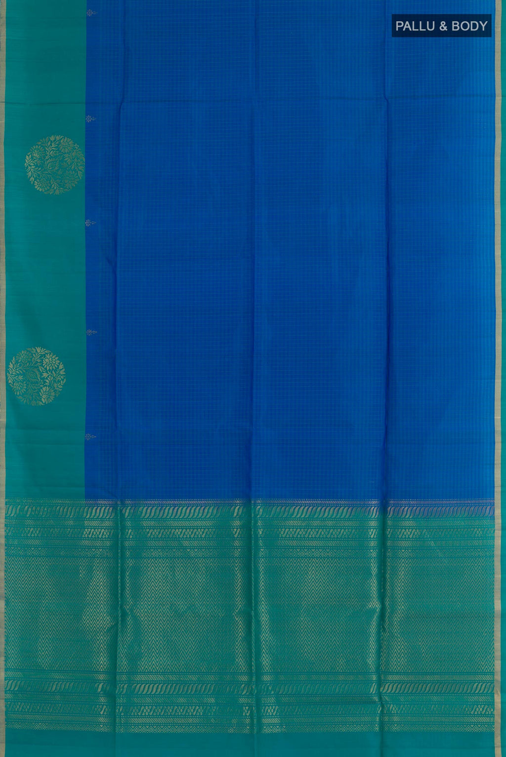 Flat view of Blue Soft Silk Saree with Zari Butta on the body and Zari Border. 