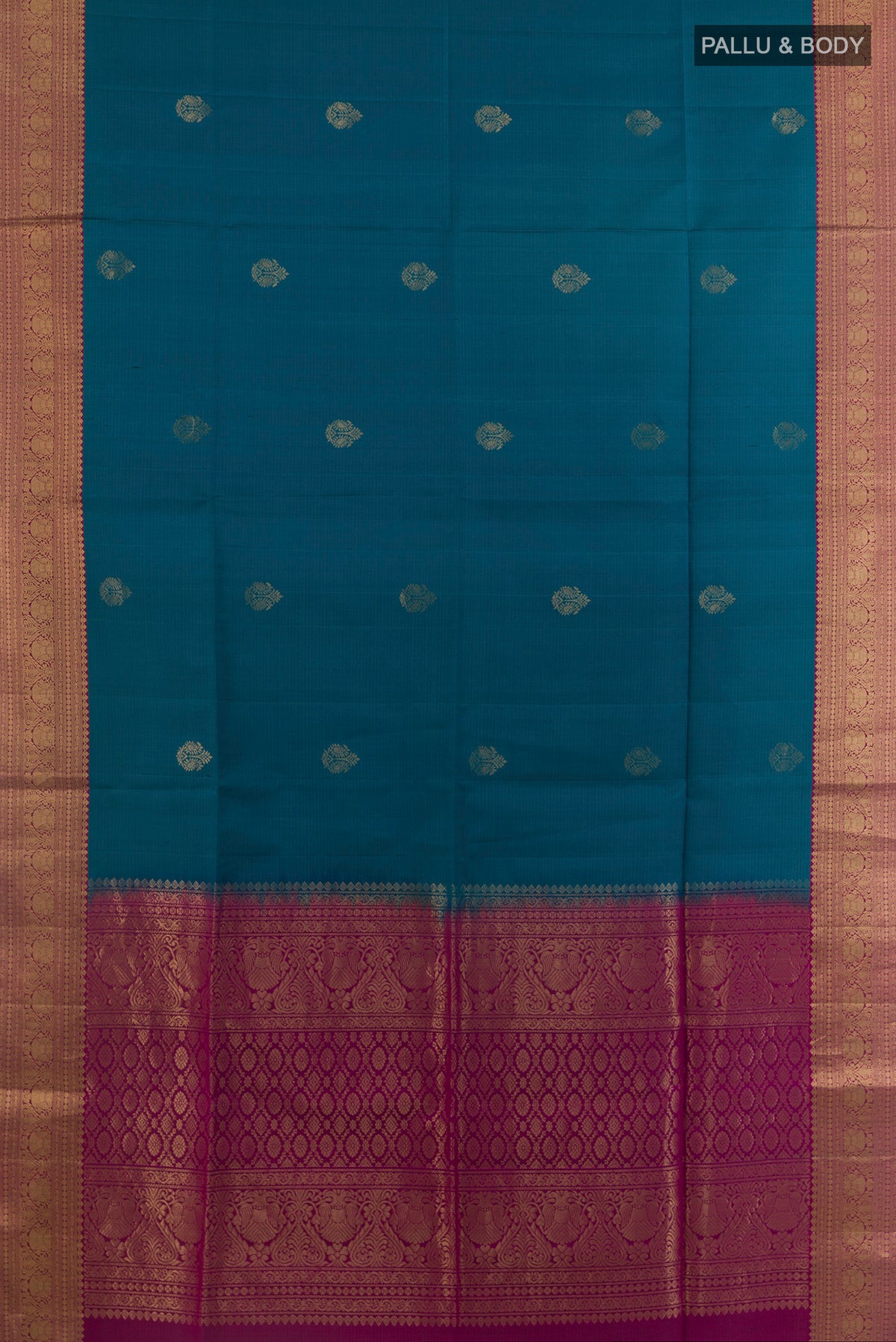 Flat view of Pure Silk Blue Soft Saree with Zari Butta on the body and Zari Border. 
