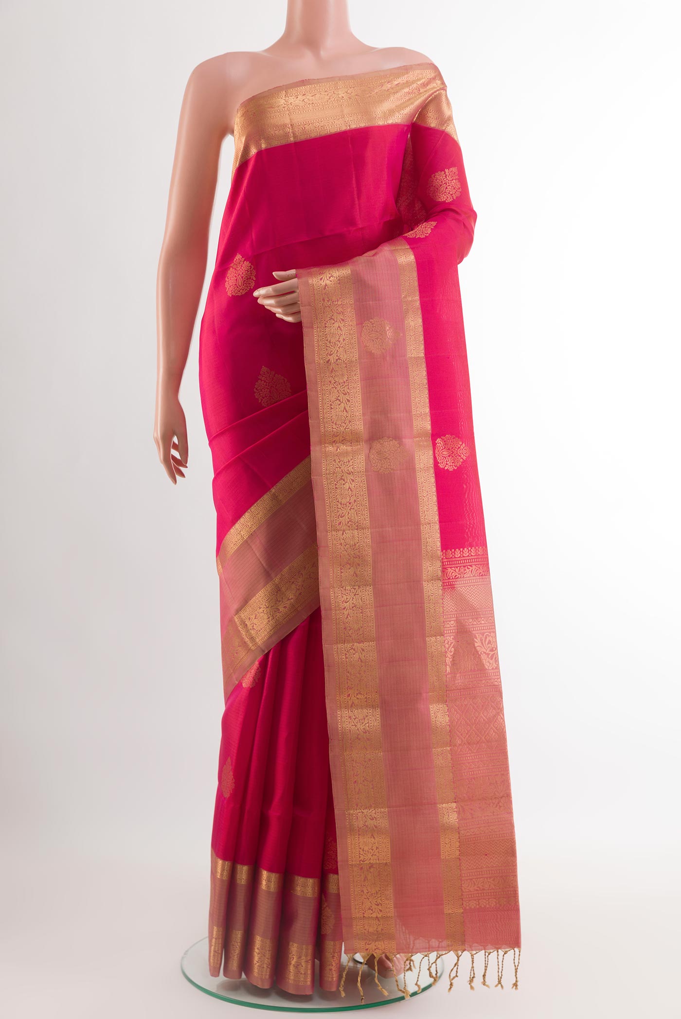 Pink Soft Silk Saree with Zari Butta on the body and Zari Border.  displayed on a mannequin