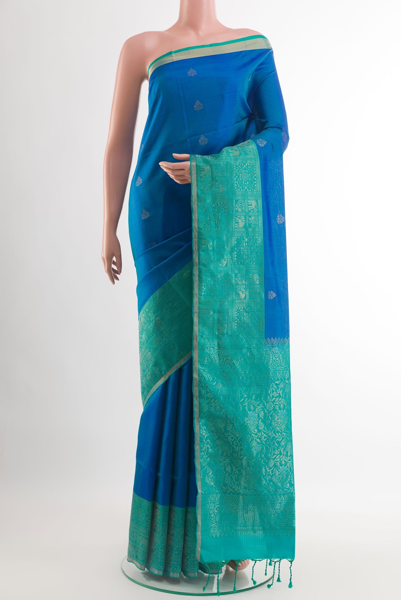 Blue Soft Silk Saree with Zari Butta on the body and Zari Border.  displayed on a mannequin