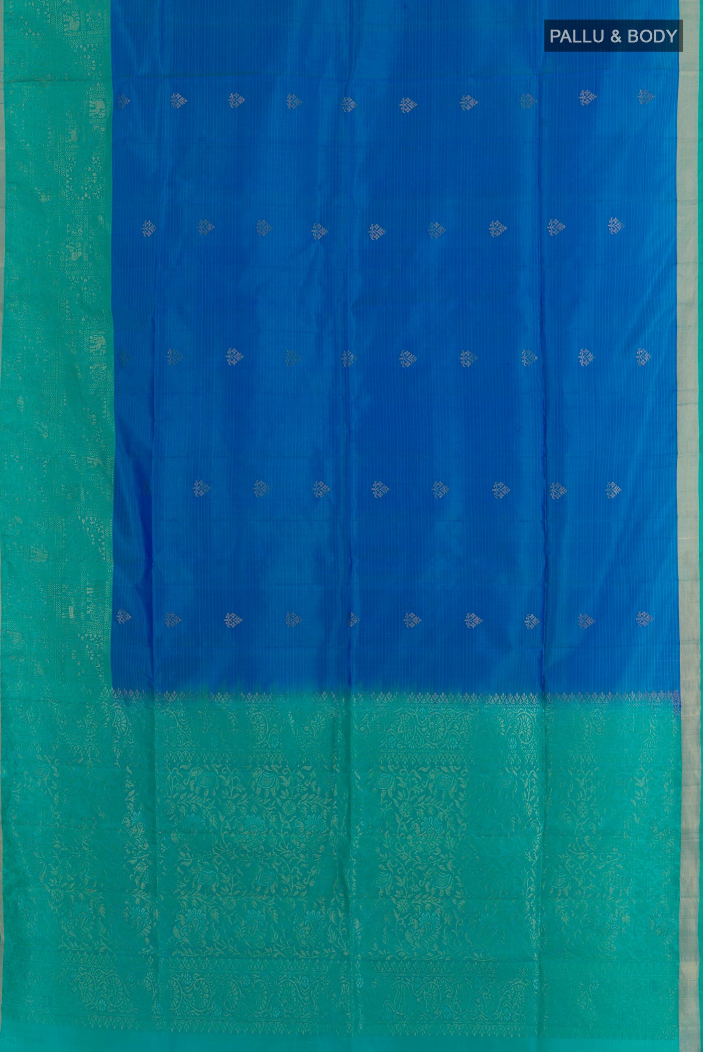 Flat view of Blue Soft Silk Saree with Zari Butta on the body and Zari Border. 