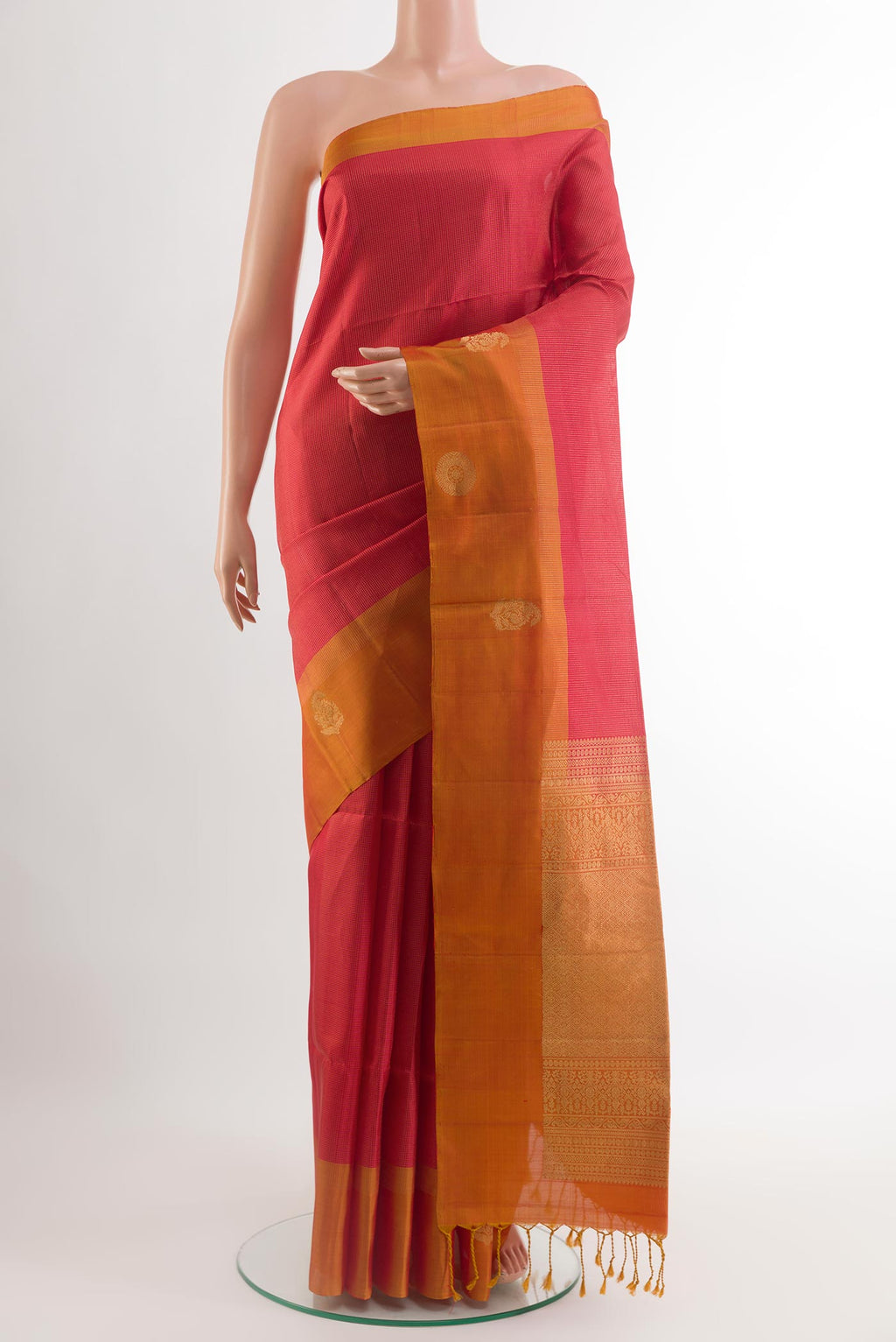 Red Soft Silk Saree with Checked design on the body and Zari Border.  displayed on a mannequin