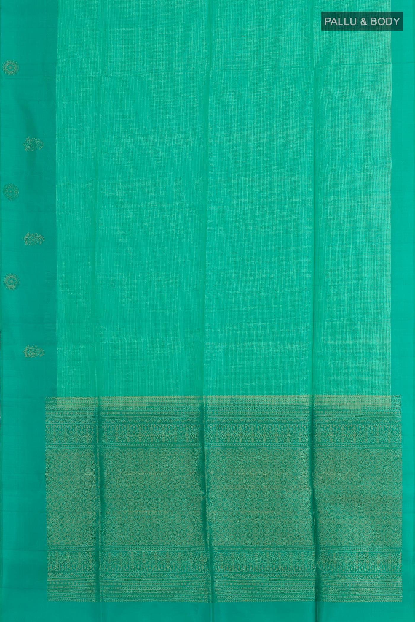 Flat view of Sea Green Soft Silk Saree with Checked design on the body and Zari Border. 