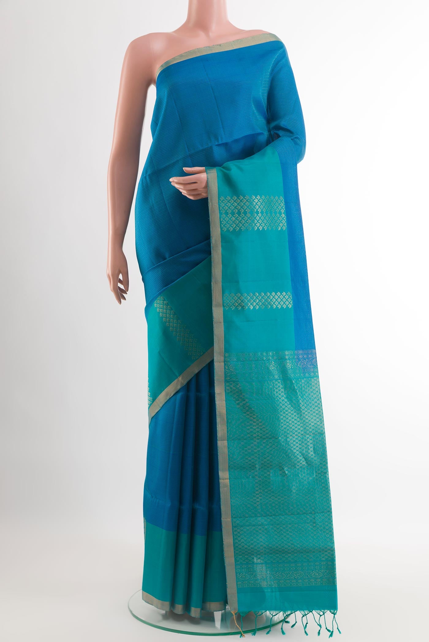 Blue Soft Silk Saree with Zari Brocade on the body and Zari Border.  displayed on a mannequin