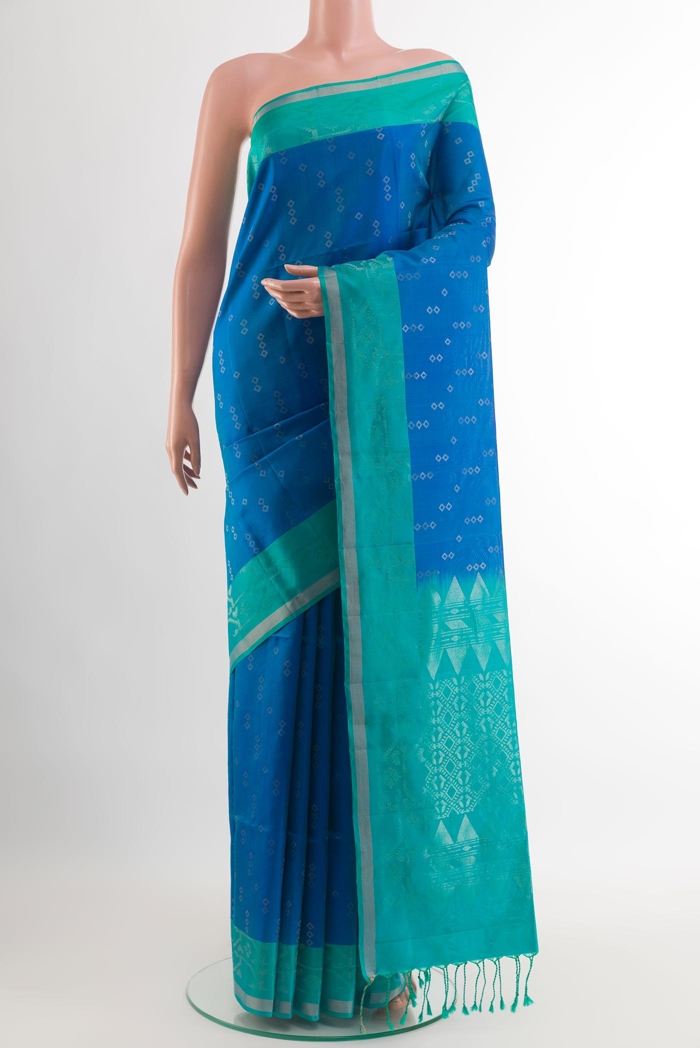 Blue Soft Silk Saree with Zari Butta on the body and Zari Border.  displayed on a mannequin