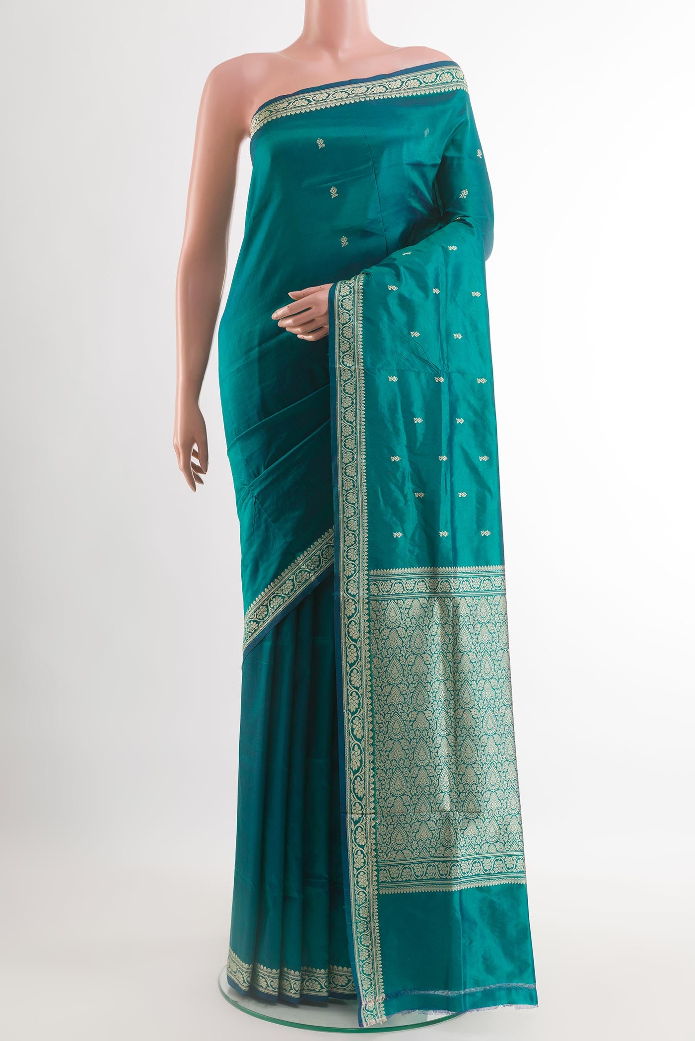 Teal Banarasi Katan Silk Saree with Zari Butta on the body and Zari Border.  displayed on a mannequin