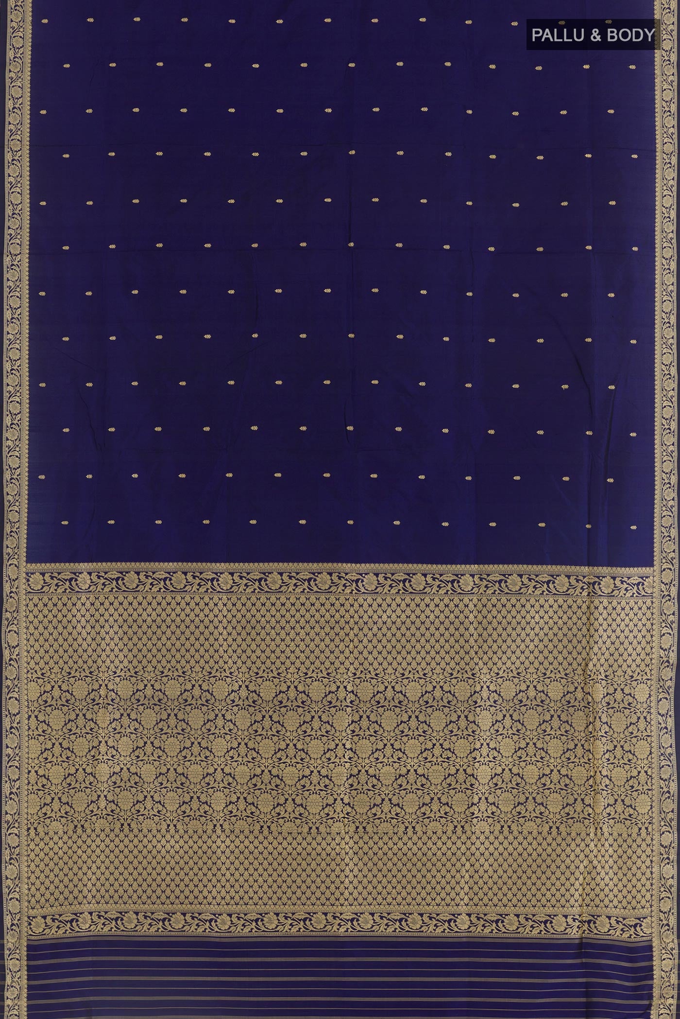 Flat view of Dark Blue Banarasi Katan Silk Saree with Zari Butta on the body and Zari Border. 
