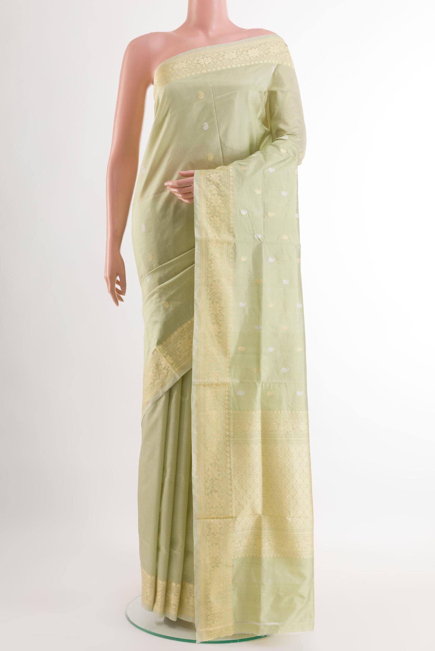 Mint Green Banarasi Katan Silk Saree with Zari Butta on the body and Zari Border.  displayed on a mannequin