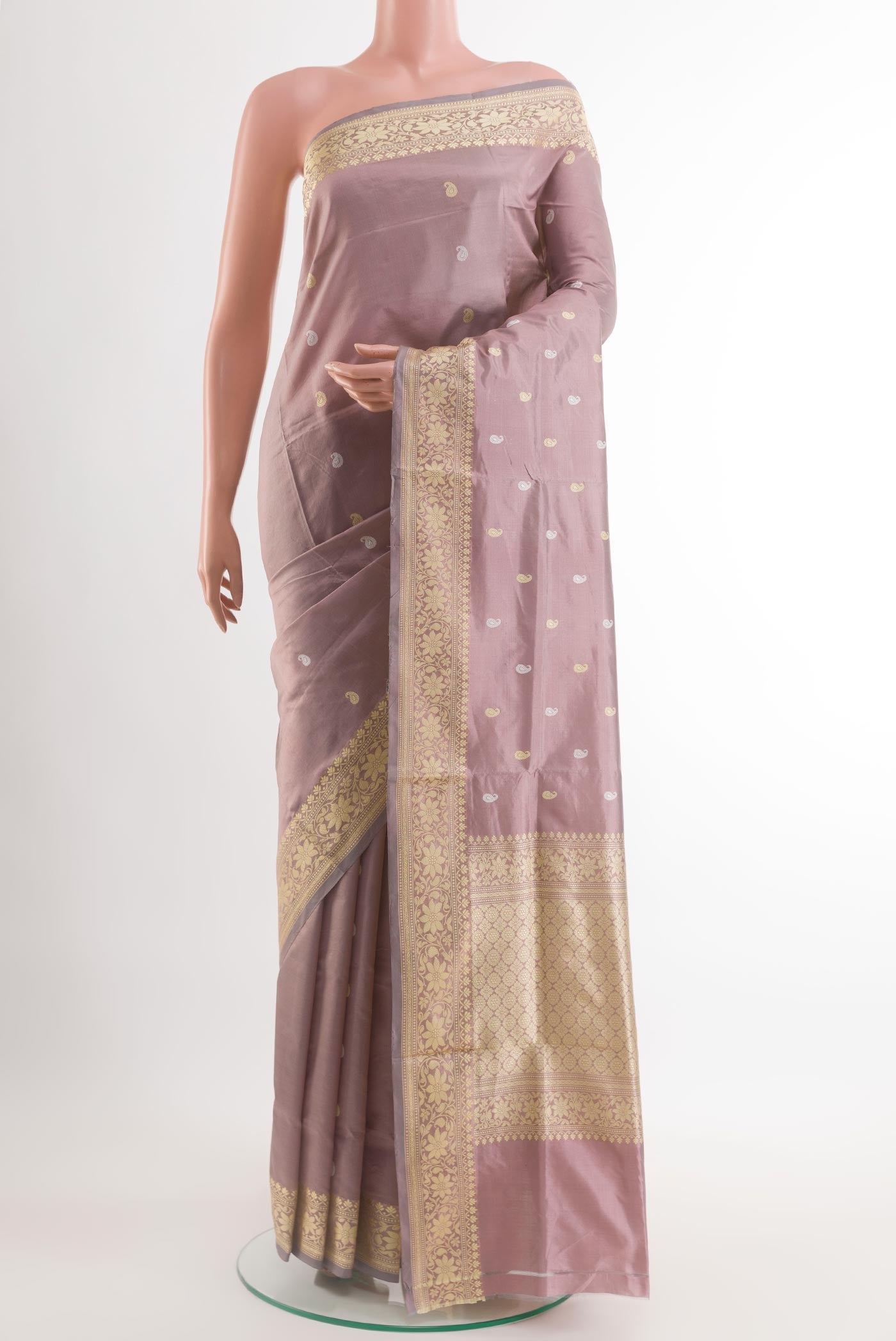 Lavender Banarasi Katan Silk Saree with Zari Butta on the body and Zari Border.  displayed on a mannequin