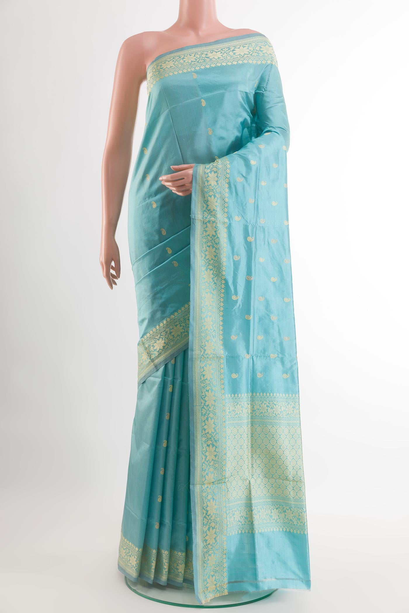 Blue Banarasi Katan Silk Saree with Zari Butta on the body and Zari Border.  displayed on a mannequin
