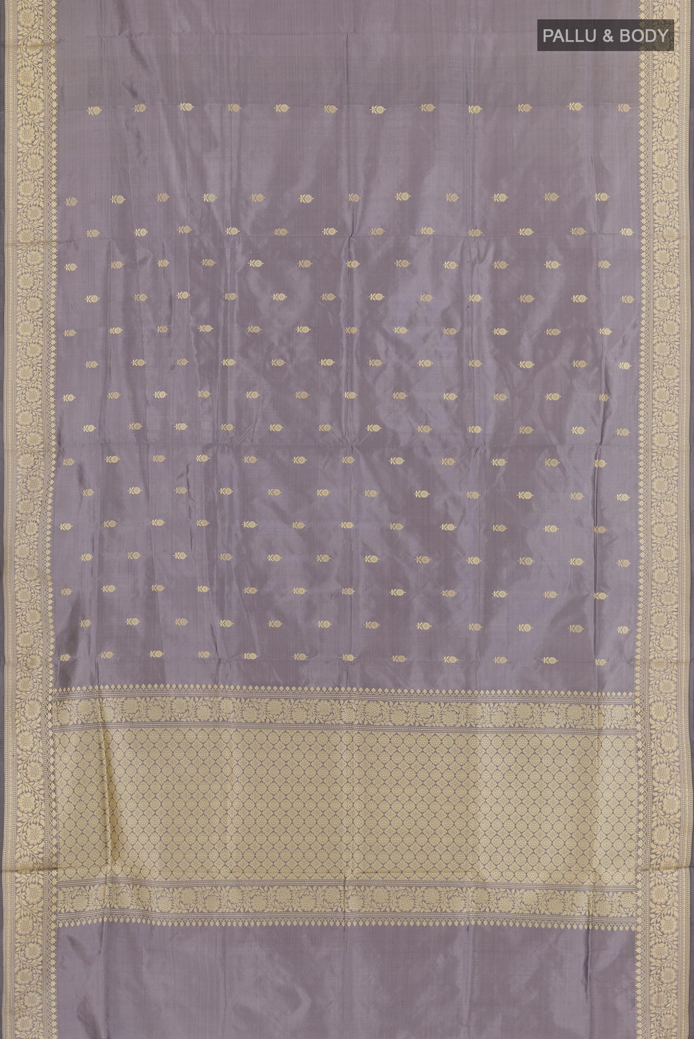 Flat view of Grey Banarasi Katan Silk Saree with Zari Butta on the body and Zari Border. 