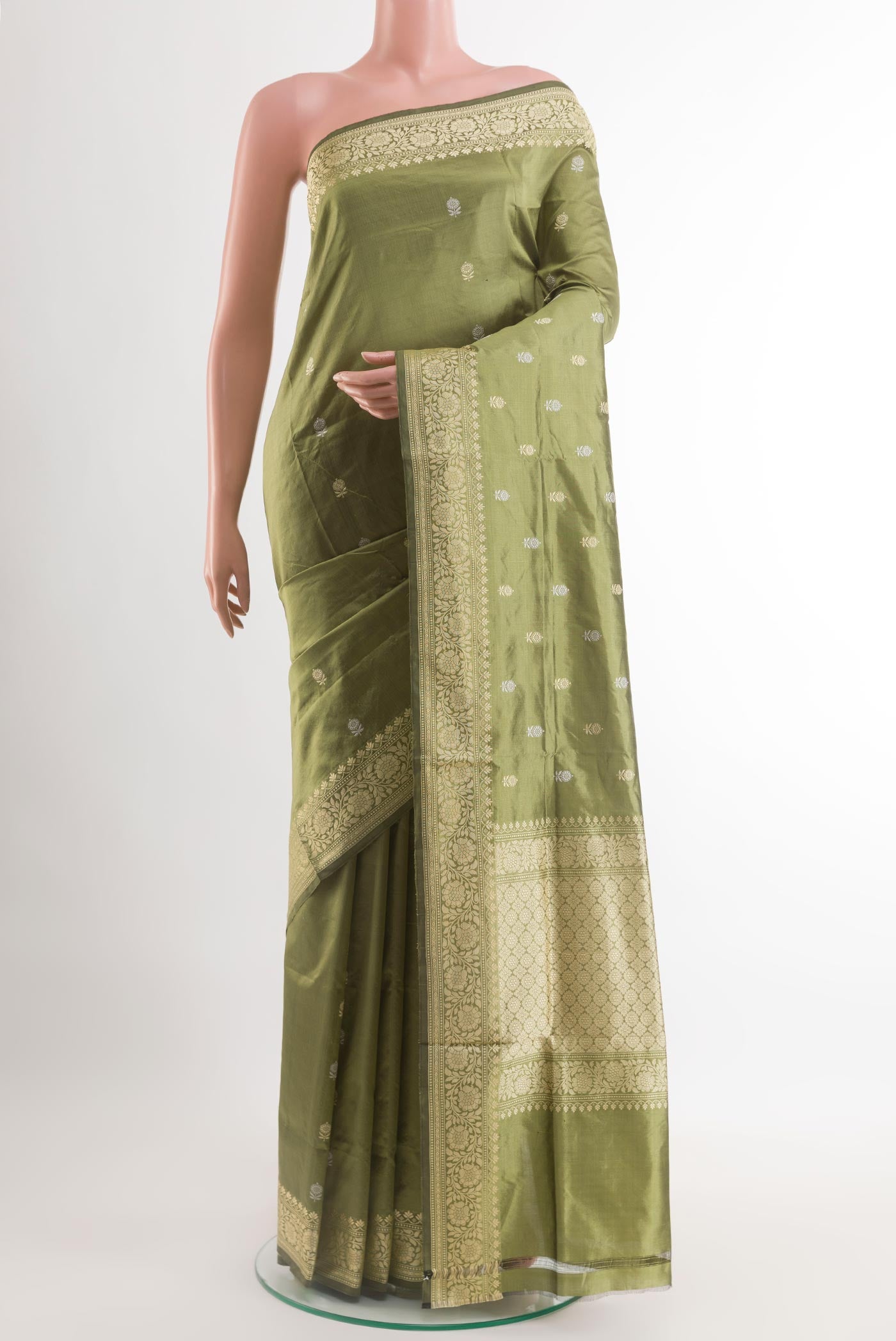 Green Banarasi Katan Silk Saree with Zari Butta on the body and Zari Border.  displayed on a mannequin