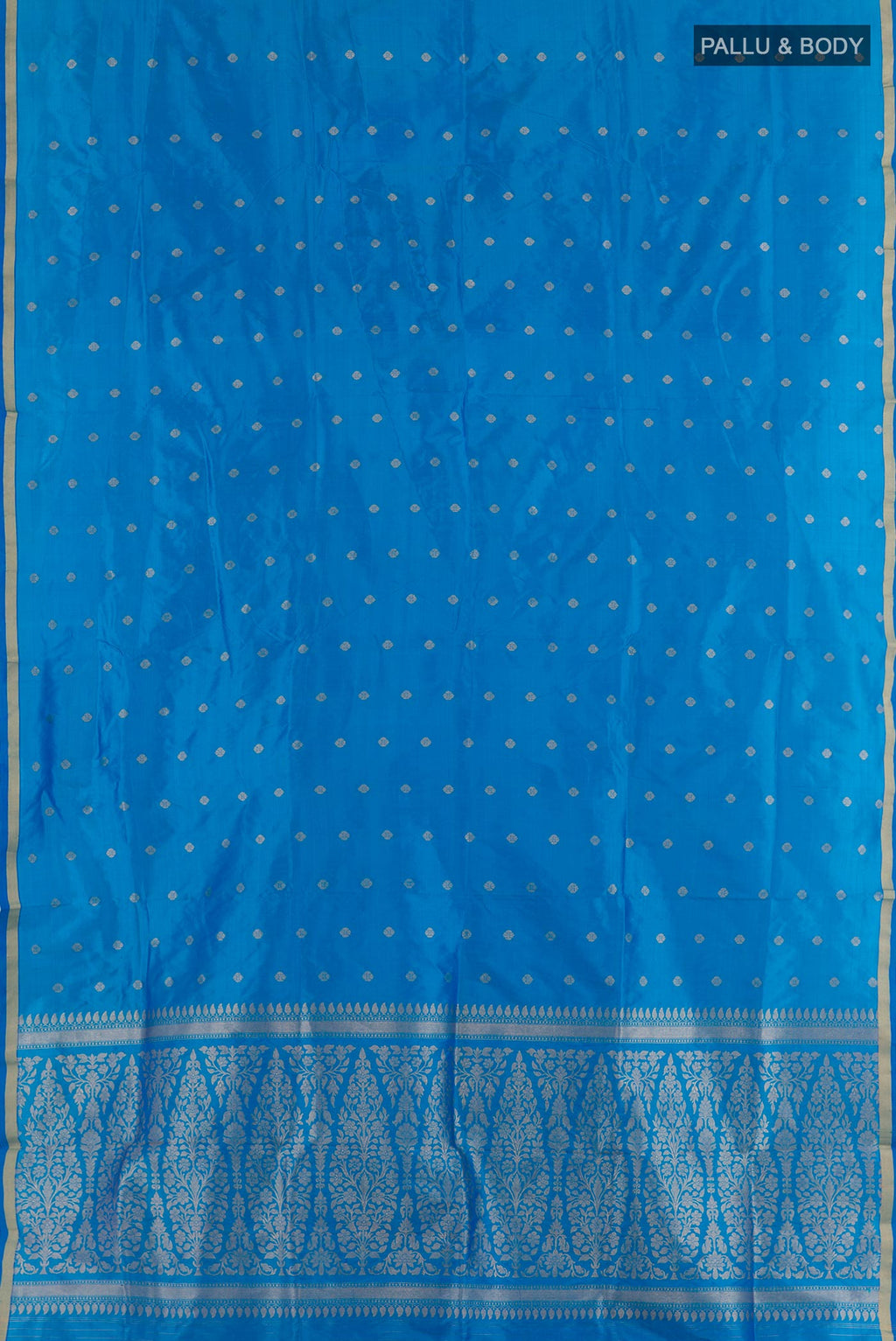 Flat view of Blue Banarasi Katan Silk Saree with Zari Butta on the body and Zari Border. 