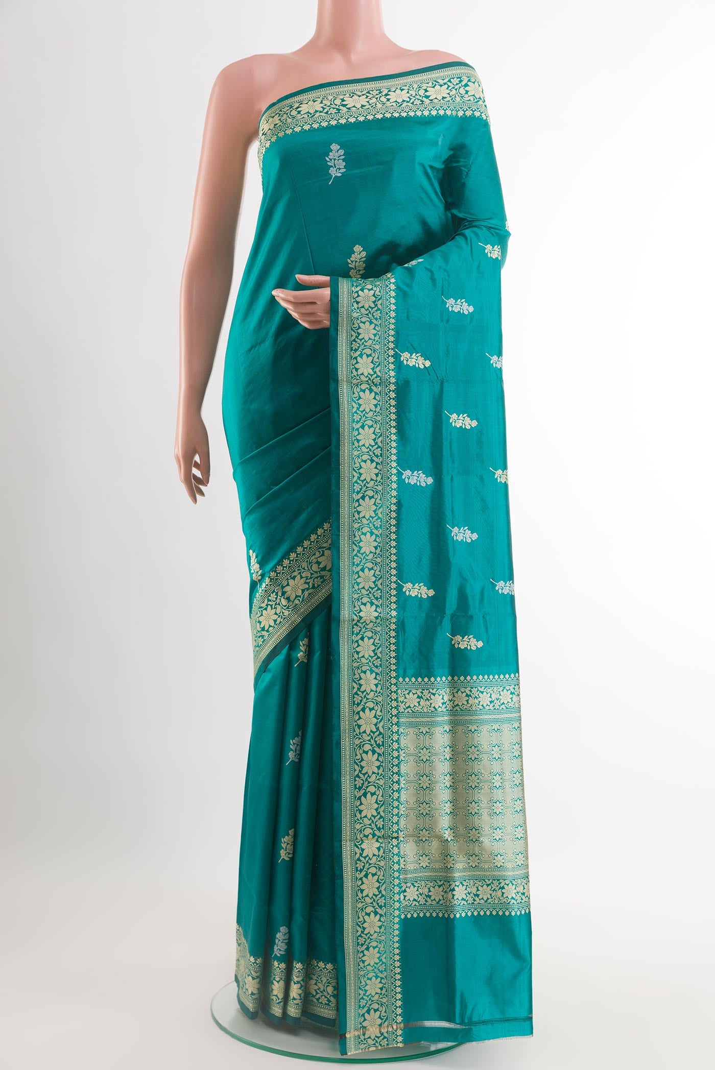 Sea Green Banarasi Katan Silk Saree with Zari Butta on the body and Zari Border.  displayed on a mannequin