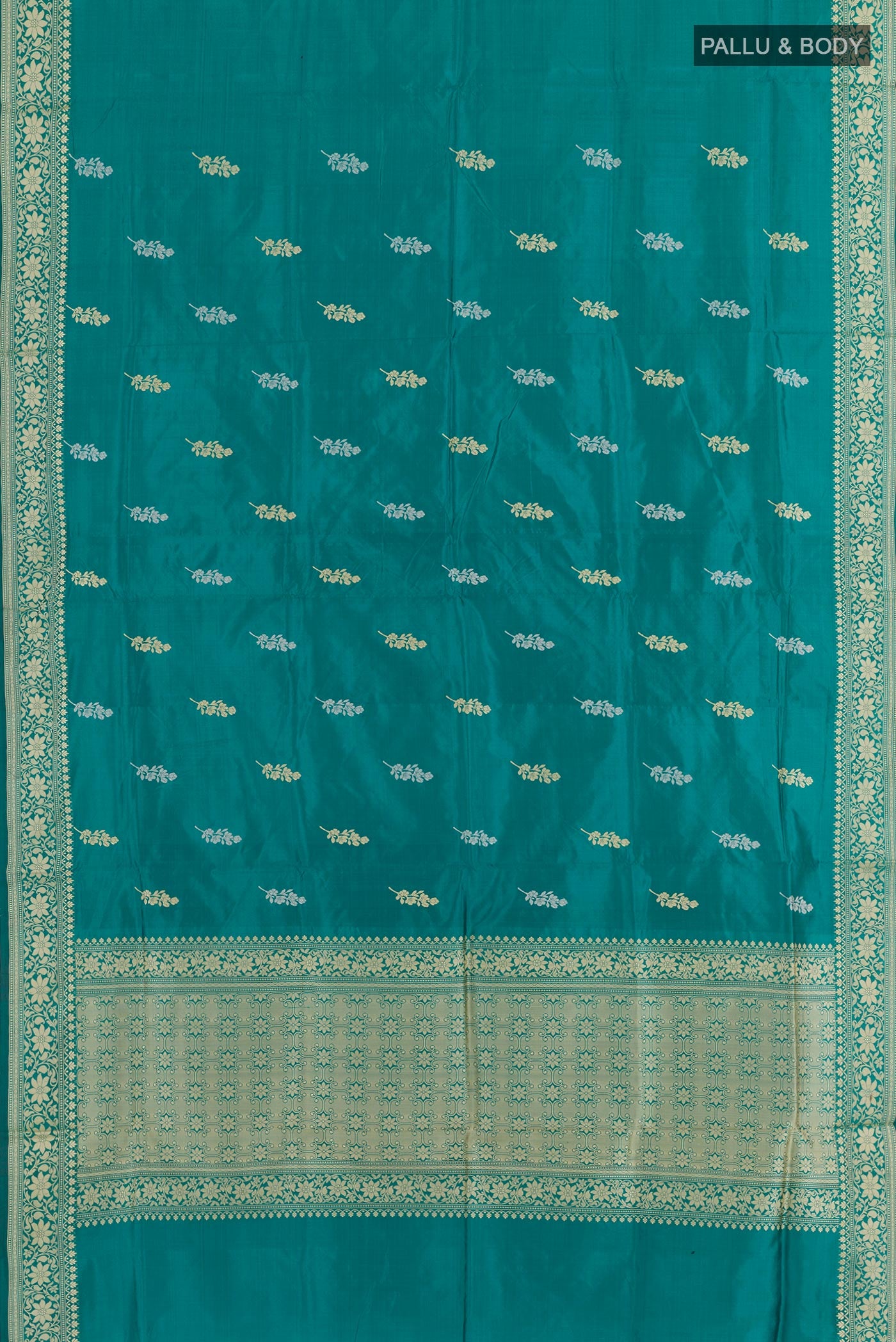 Flat view of Sea Green Banarasi Katan Silk Saree with Zari Butta on the body and Zari Border. 