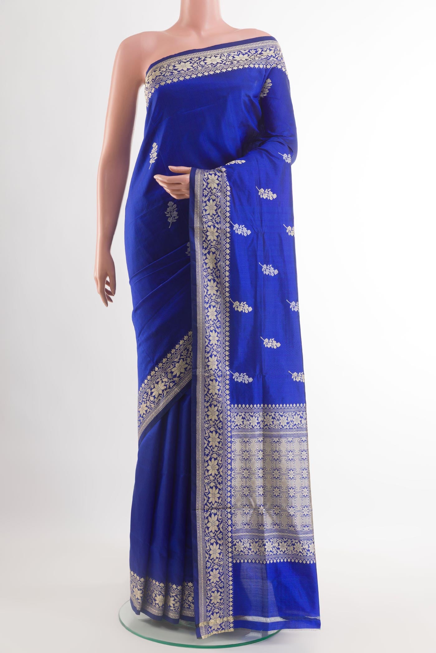 Blue Banarasi Katan Silk Saree with Zari Butta on the body and Zari Border.  displayed on a mannequin