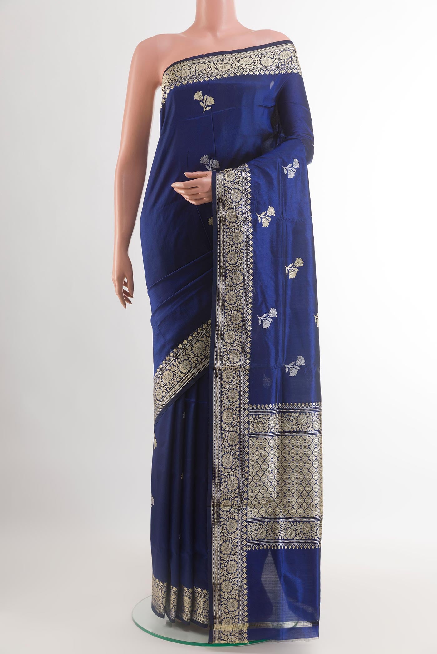 Blue Banarasi Katan Silk Saree with Zari Butta on the body and Zari Border.  displayed on a mannequin