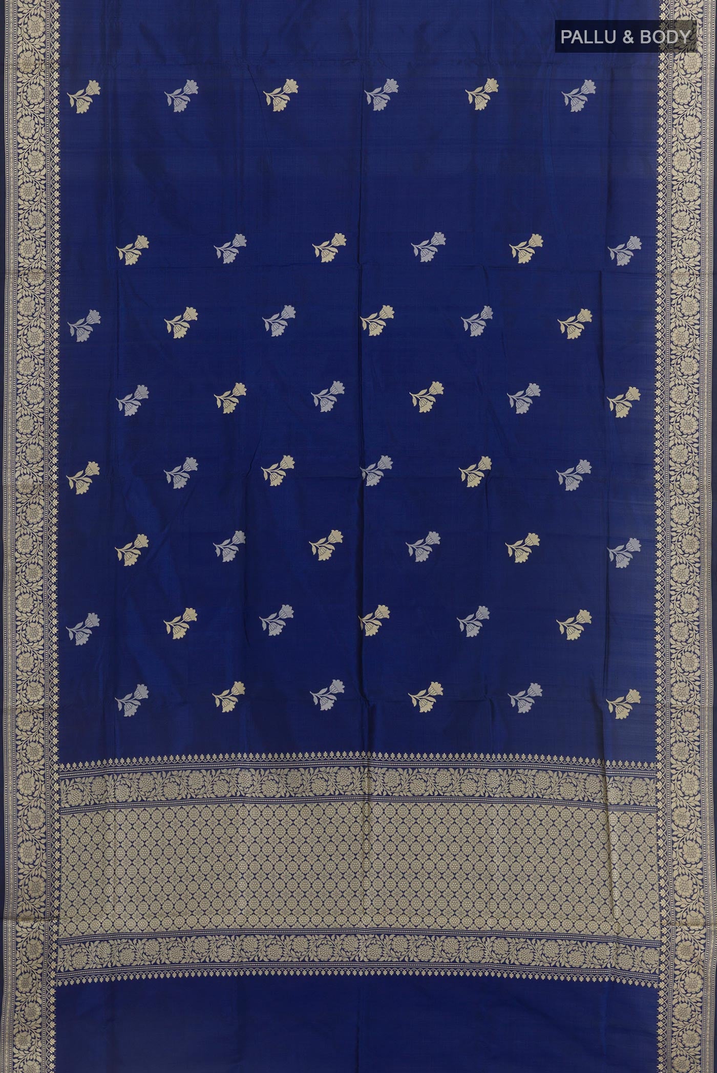Flat view of Blue Banarasi Katan Silk Saree with Zari Butta on the body and Zari Border. 