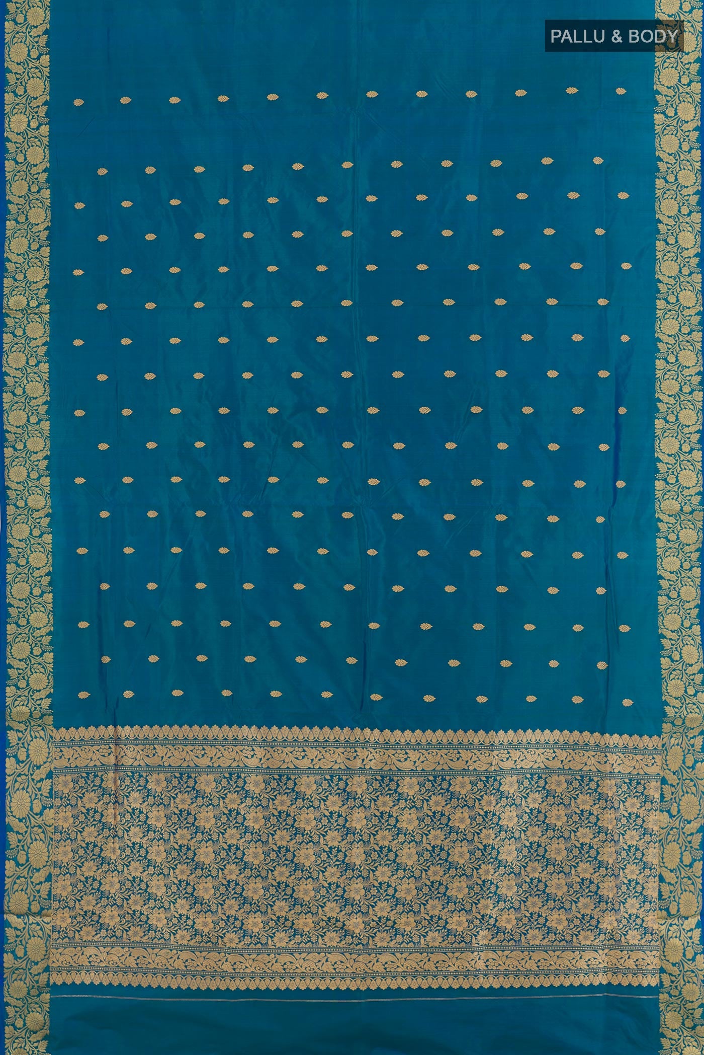 Flat view of Blue Banarasi Katan Silk Saree with Zari Butta on the body and Zari Border. 