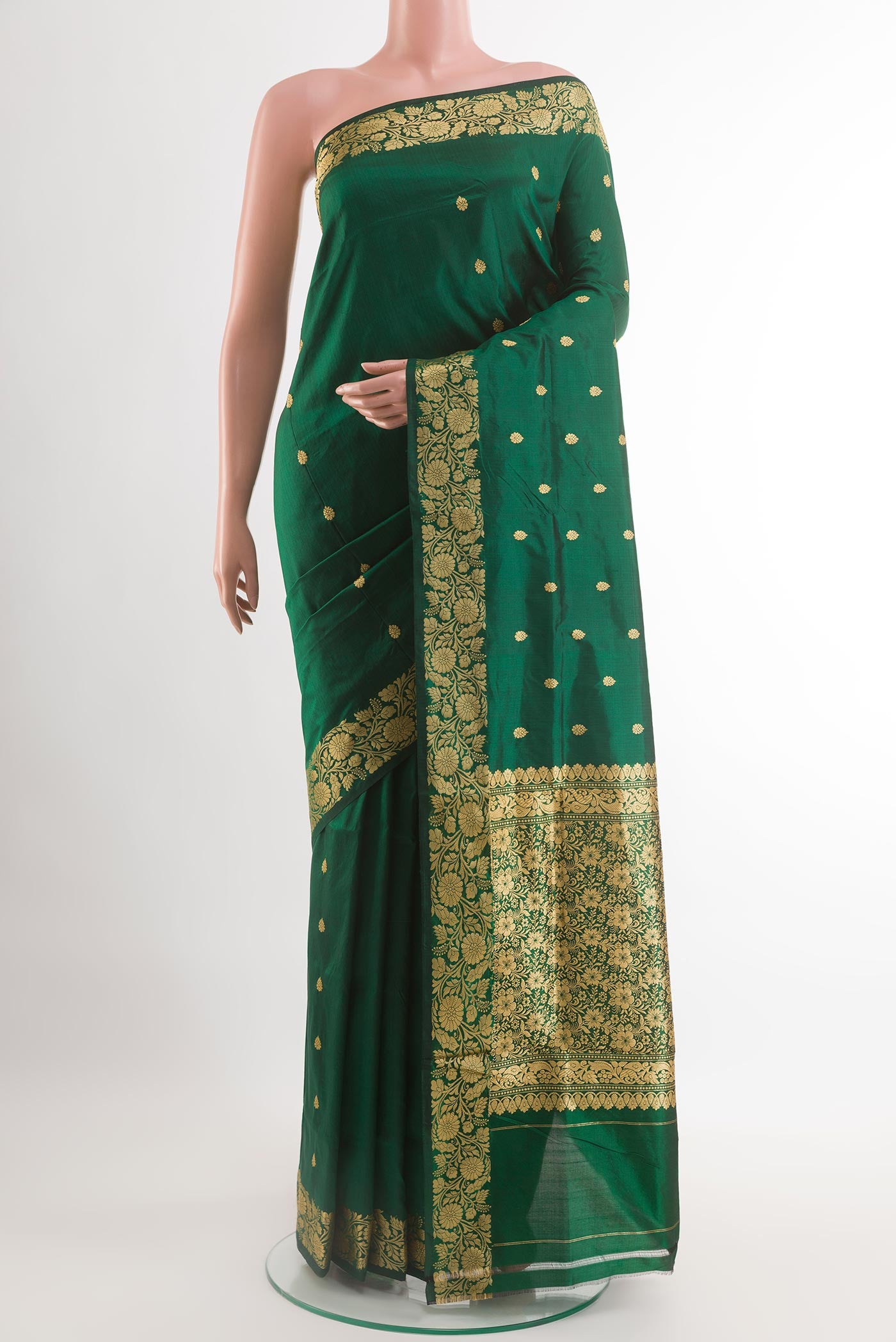 Green Banarasi Katan Silk Saree with Zari Butta on the body and Zari Border.  displayed on a mannequin