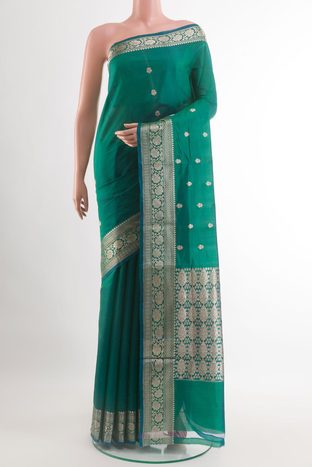 Green Banarasi Katan Silk Saree with Zari Butta on the body and Zari Border.  displayed on a mannequin