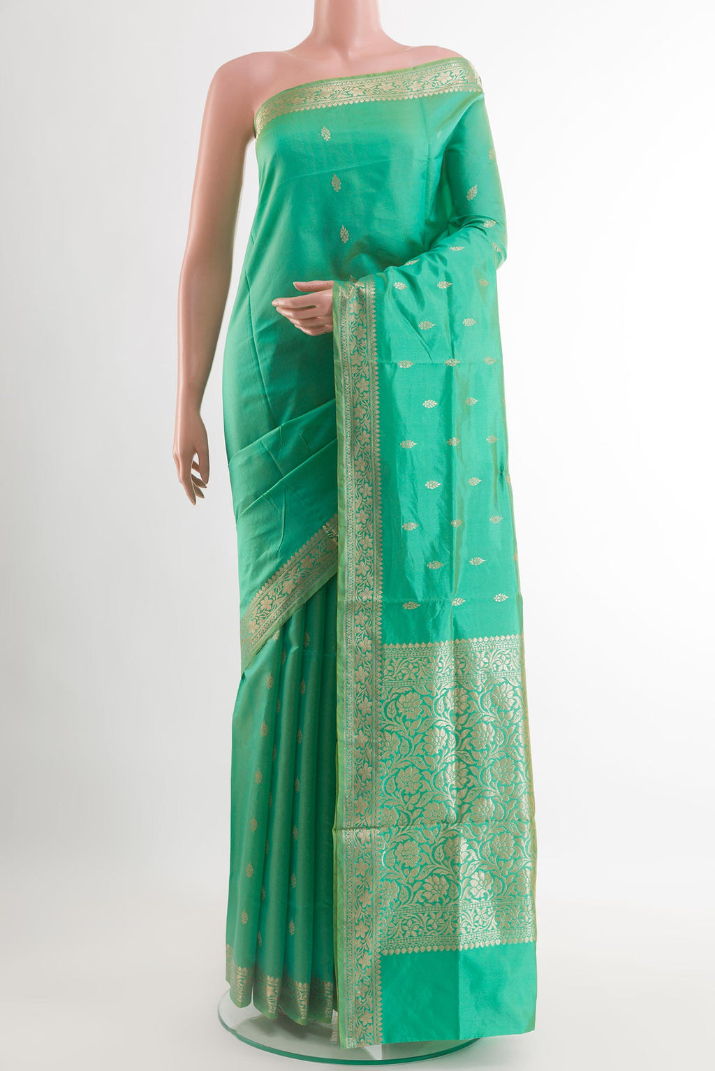 Sea Green Banarasi Katan Silk Saree with Zari Butta on the body and Zari Border.  displayed on a mannequin