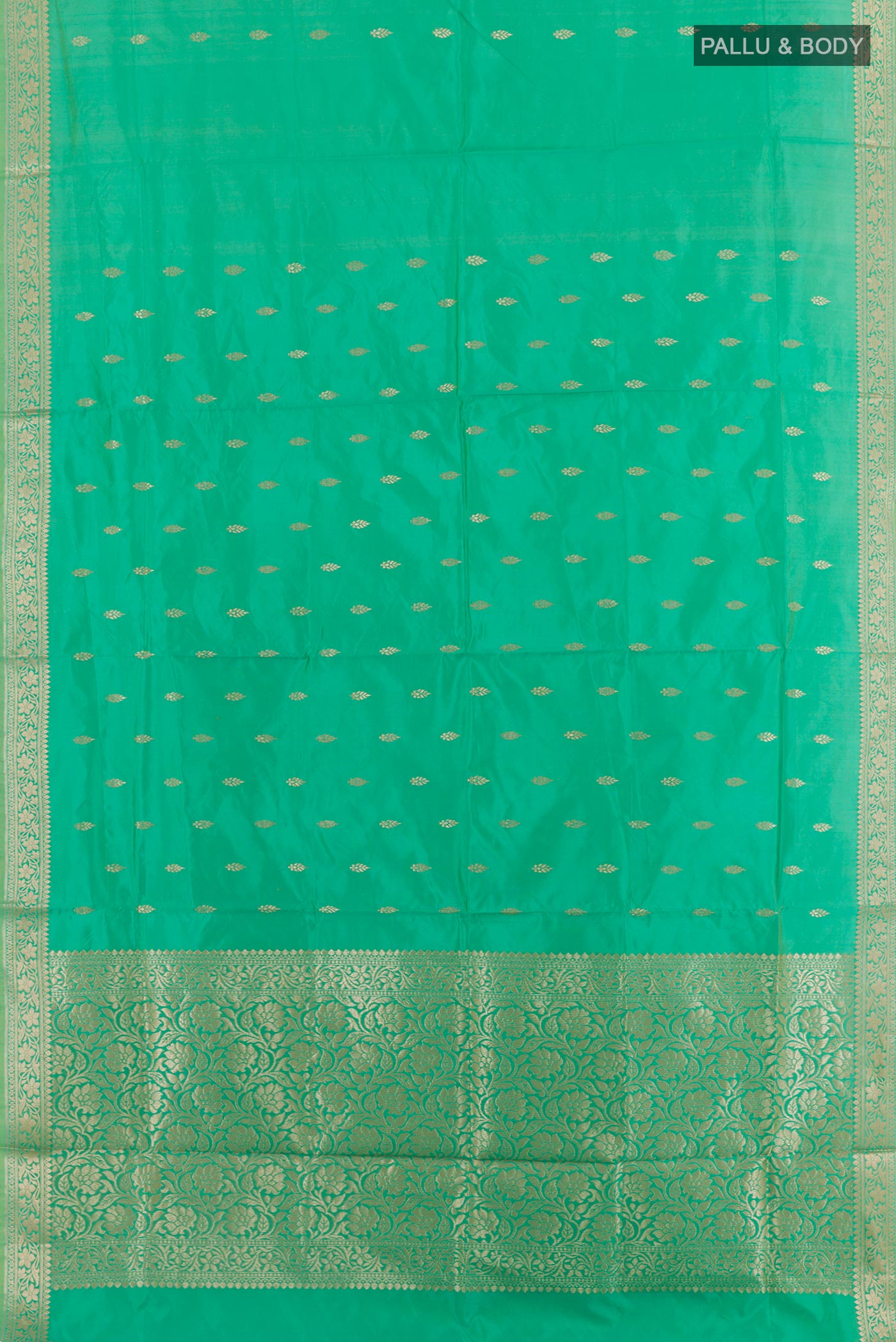 Flat view of Sea Green Banarasi Katan Silk Saree with Zari Butta on the body and Zari Border. 