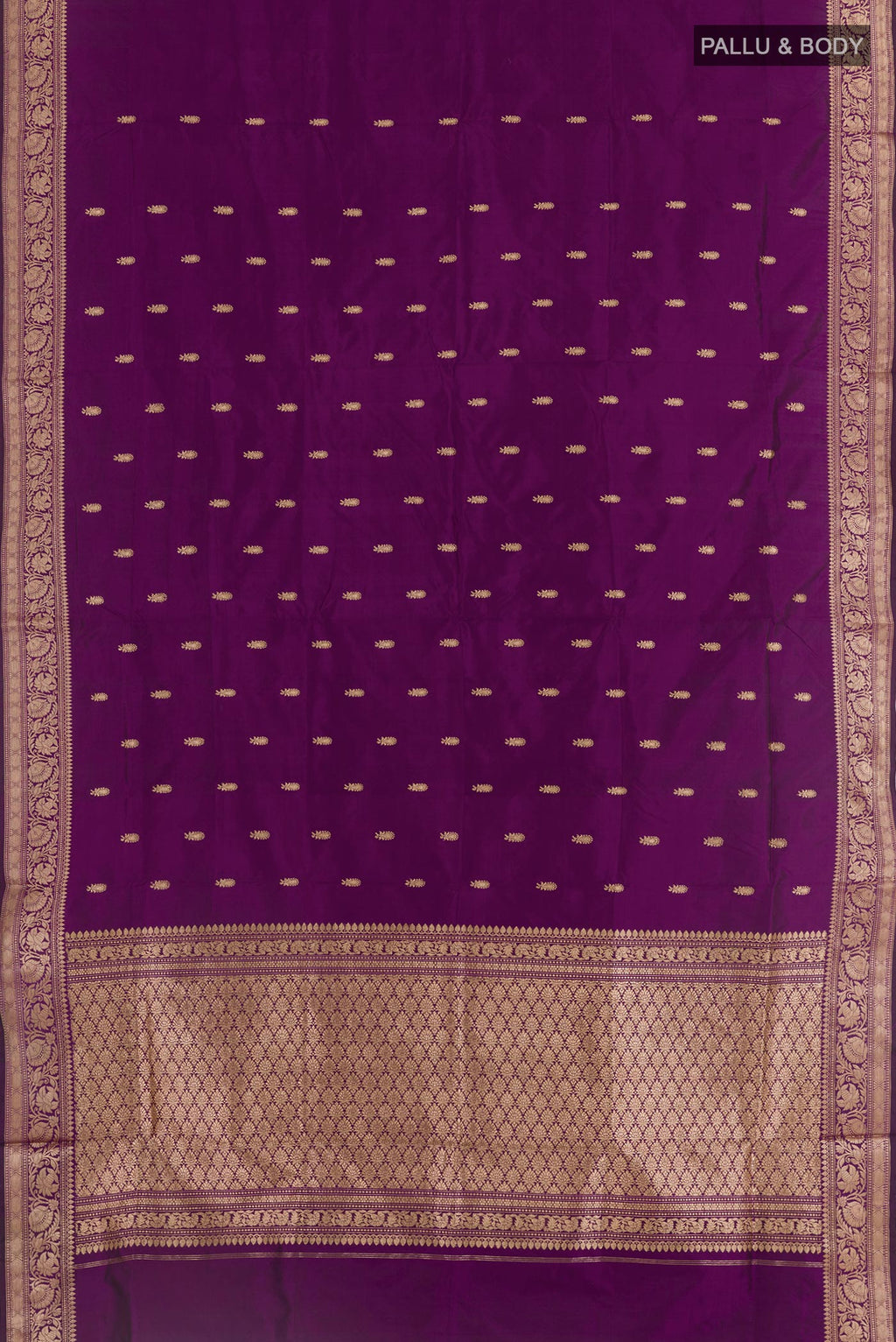 Flat view of Purple Banarasi Katan Silk Saree with Zari Butta on the body and Zari Border. 