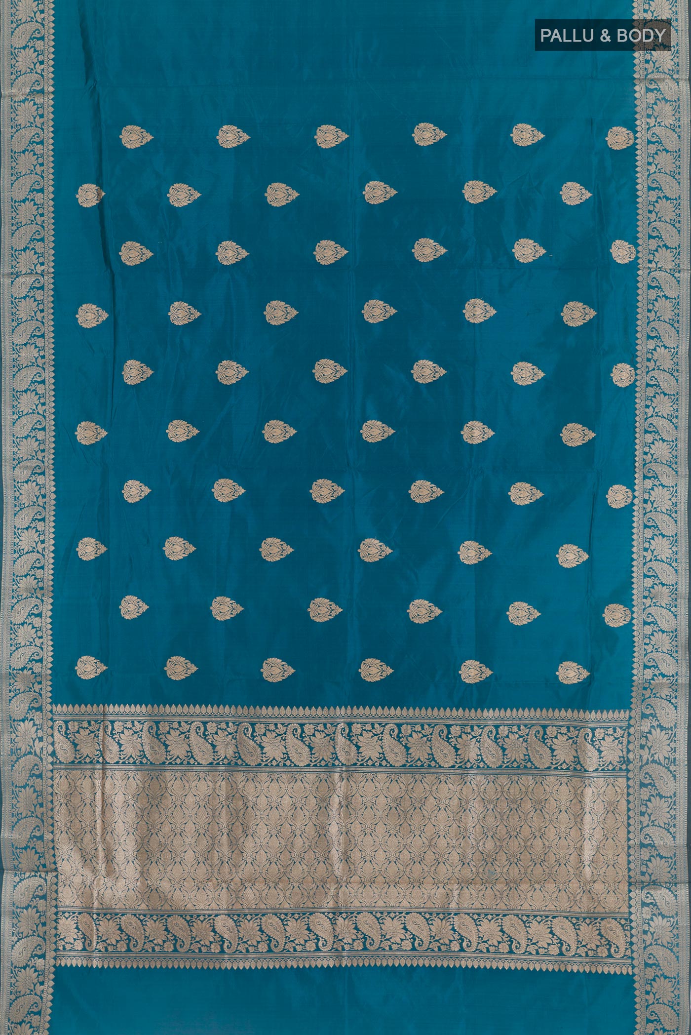 Flat view of Blue Banarasi Katan Silk Saree with Zari Butta on the body and Zari Border. 