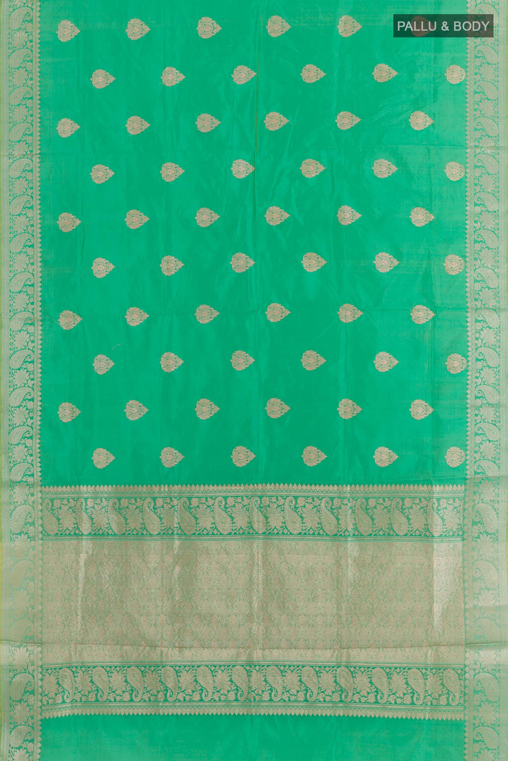 Flat view of Green Banarasi Katan Silk Saree with Zari Butta on the body and Zari Border. 