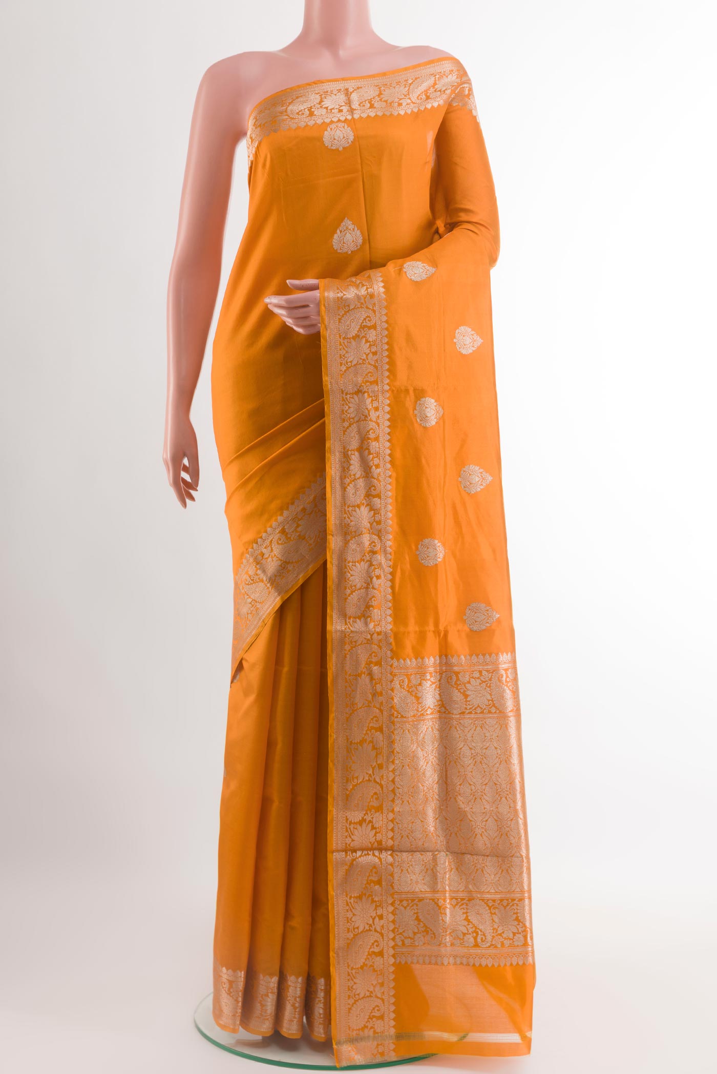 Yellow Banarasi Katan Silk Saree with Zari Butta on the body and Zari Border.  displayed on a mannequin