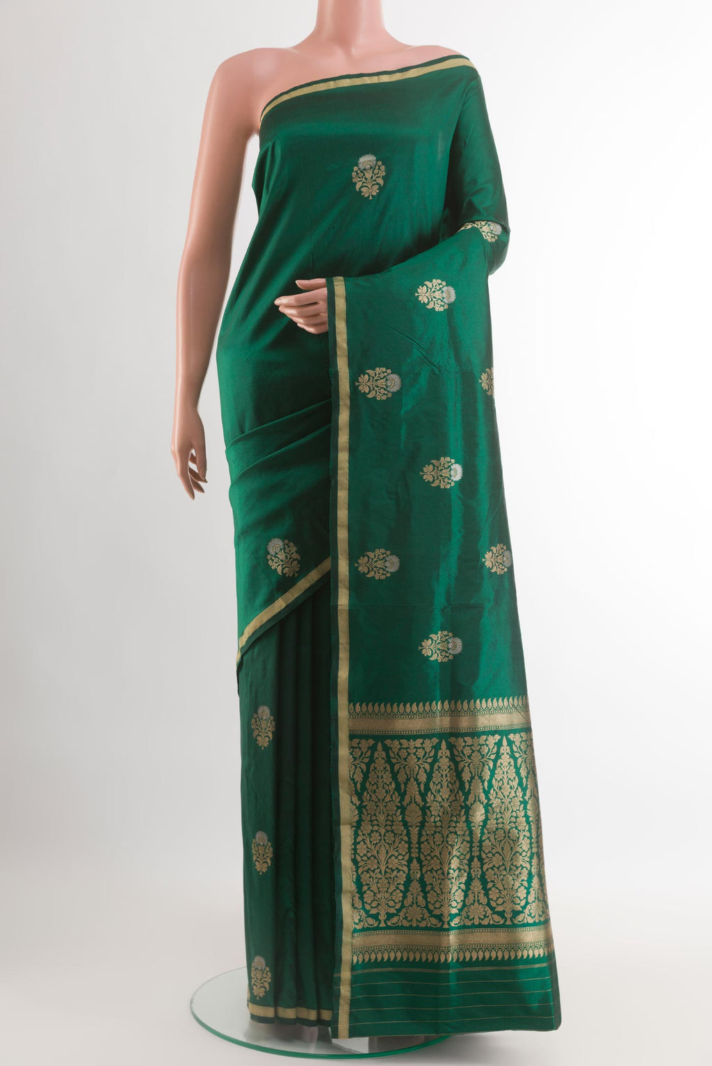 Green Banarasi Katan Silk Saree with Zari Butta on the body and Zari Border.  displayed on a mannequin