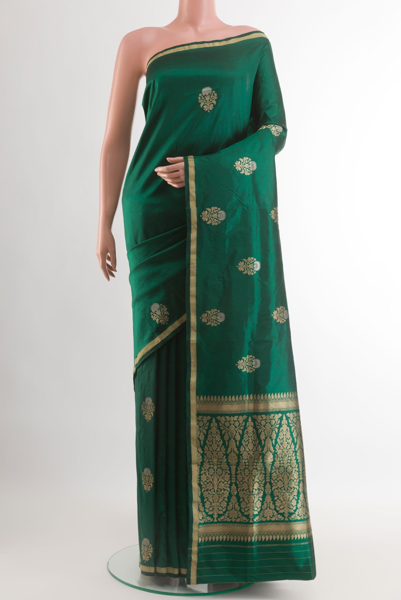 Green Banarasi Katan Silk Saree with Zari Butta on the body and Zari Border.  displayed on a mannequin