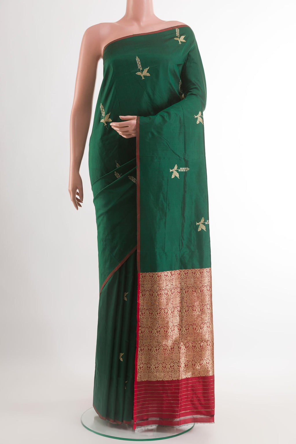 Green Banarasi Katan Silk Saree with Zari Butta on the body and Zari Border.  displayed on a mannequin