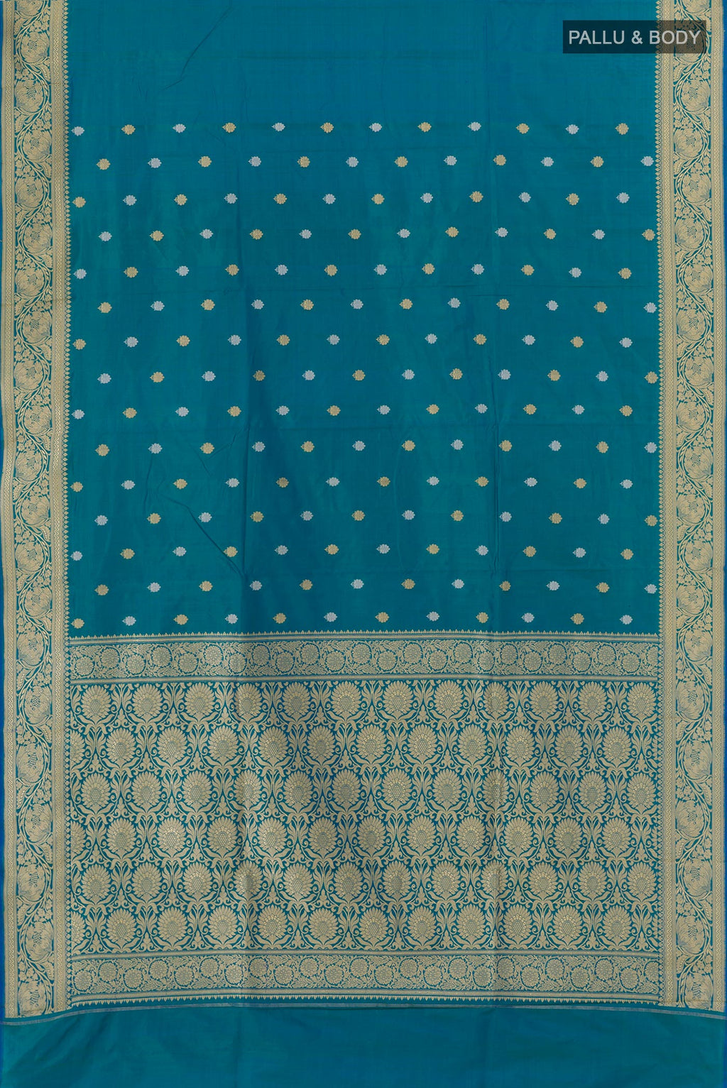 Flat view of Blue Banarasi Katan Silk Saree with Zari Butta on the body and Zari Border. 