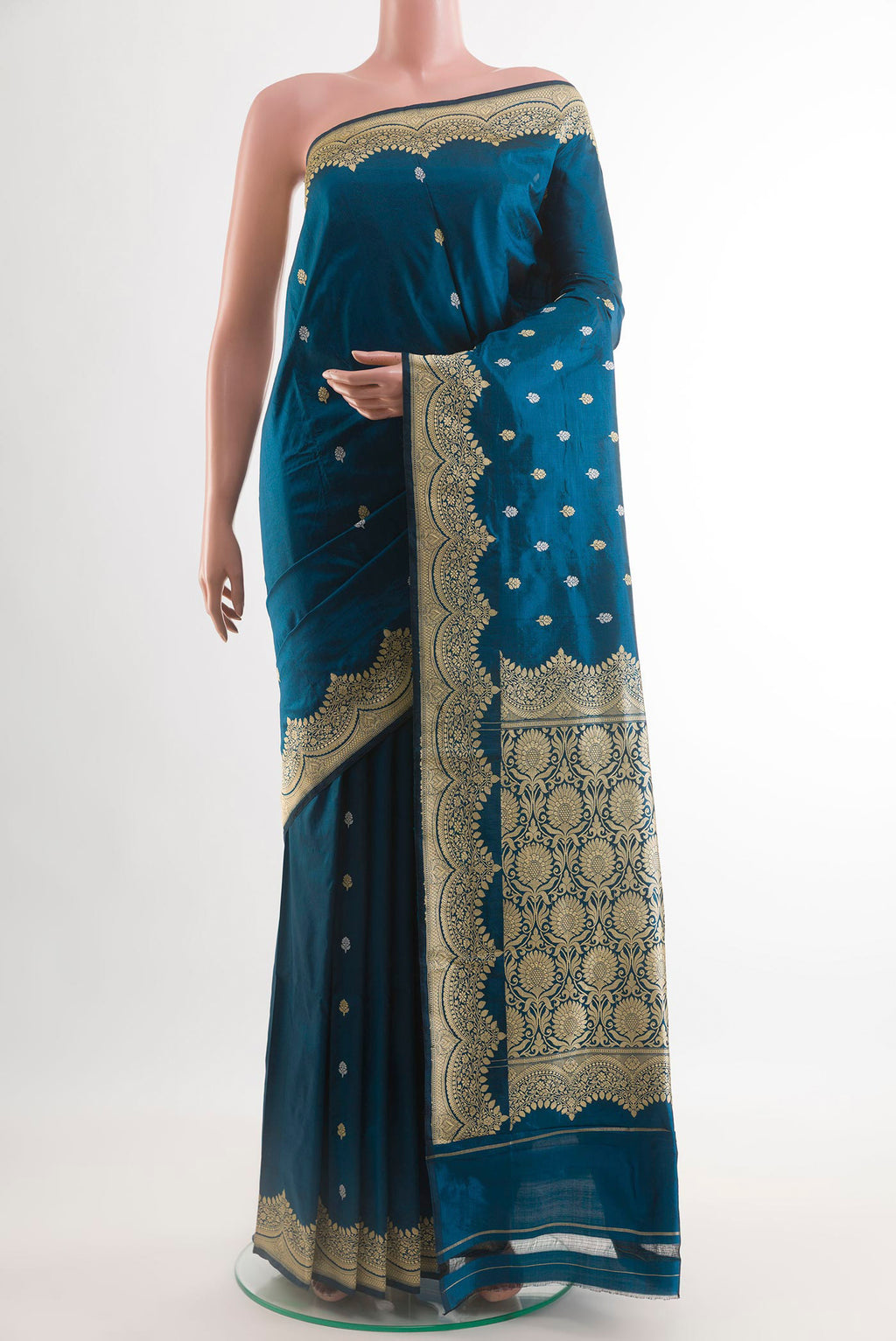 Blue Banarasi Katan Silk Saree with Zari Butta on the body and Zari Border.  displayed on a mannequin