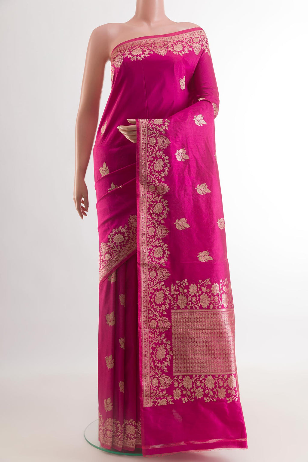 Rani Pink Banarasi Katan Silk Saree with Zari Butta on the body and Zari Border.  displayed on a mannequin